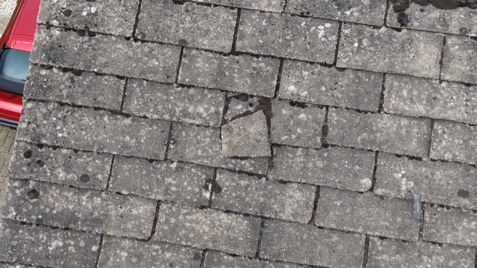 Drone close-up of a cracked roof tile